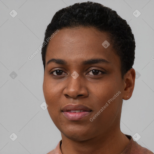 Joyful black young-adult female with short  black hair and brown eyes