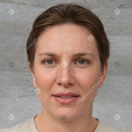 Joyful white adult female with short  brown hair and grey eyes