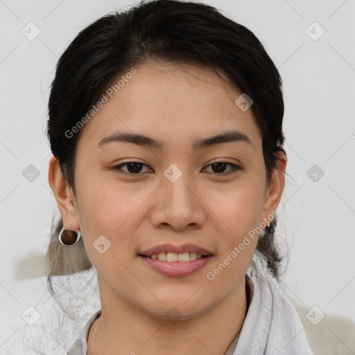 Joyful asian young-adult female with short  brown hair and brown eyes