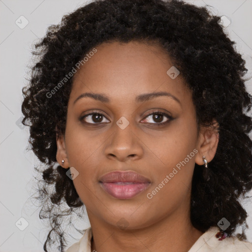 Joyful black young-adult female with long  brown hair and brown eyes