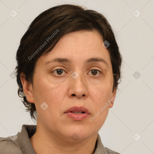 Joyful white adult female with medium  brown hair and brown eyes