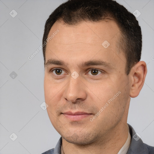 Joyful white young-adult male with short  brown hair and brown eyes