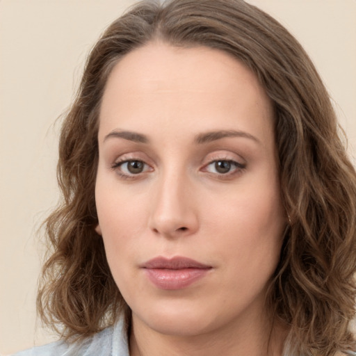 Neutral white young-adult female with long  brown hair and green eyes