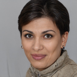 Joyful white adult female with medium  brown hair and brown eyes