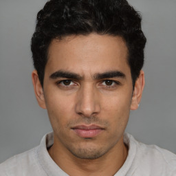 Neutral white young-adult male with short  black hair and brown eyes