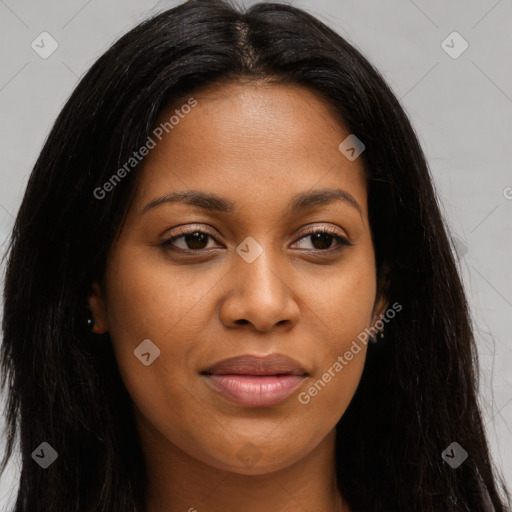 Joyful black young-adult female with long  brown hair and brown eyes