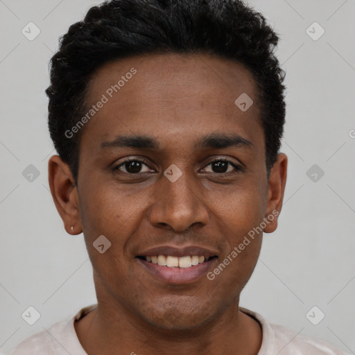 Joyful black young-adult male with short  black hair and brown eyes