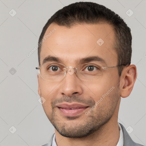 Joyful white young-adult male with short  brown hair and brown eyes