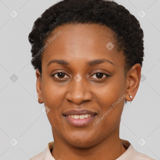 Joyful black young-adult female with short  black hair and brown eyes