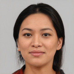 Joyful asian young-adult female with medium  brown hair and brown eyes