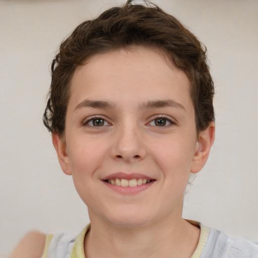 Joyful white child female with short  brown hair and brown eyes