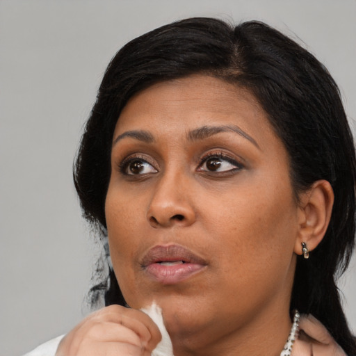 Neutral black young-adult female with short  black hair and brown eyes