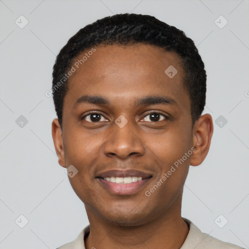 Joyful black young-adult male with short  black hair and brown eyes