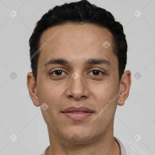 Joyful white young-adult male with short  black hair and brown eyes