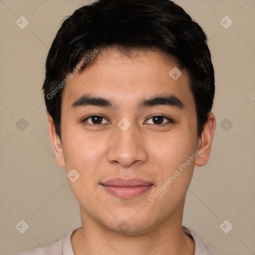 Joyful white young-adult male with short  black hair and brown eyes