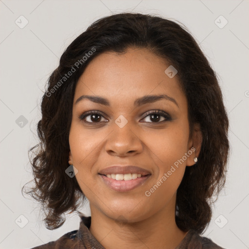 Joyful black young-adult female with medium  brown hair and brown eyes