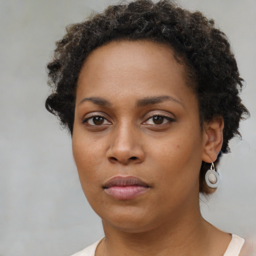 Neutral black young-adult female with short  brown hair and brown eyes