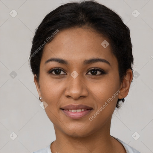 Joyful latino young-adult female with short  brown hair and brown eyes