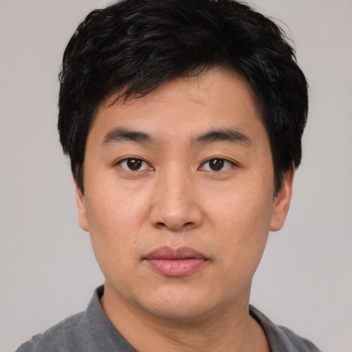 Neutral asian young-adult male with short  black hair and brown eyes