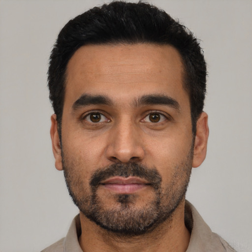 Neutral latino young-adult male with short  black hair and brown eyes