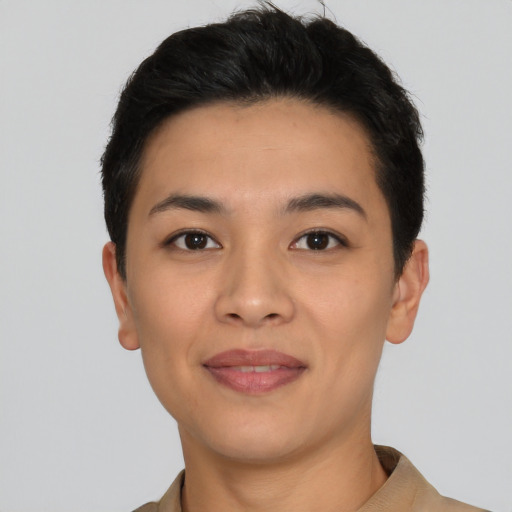 Joyful latino young-adult female with short  black hair and brown eyes