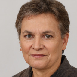 Joyful white middle-aged female with short  brown hair and brown eyes