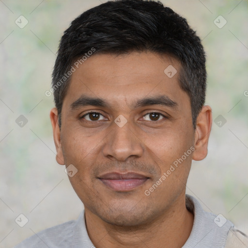 Joyful latino young-adult male with short  black hair and brown eyes