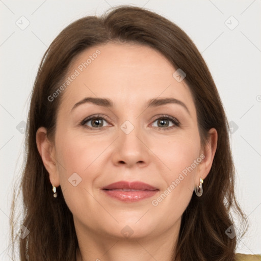 Joyful white adult female with long  brown hair and brown eyes