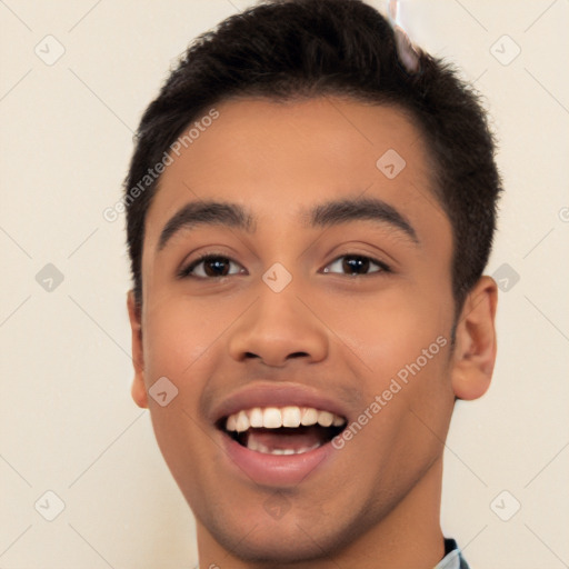 Joyful latino young-adult male with short  black hair and brown eyes