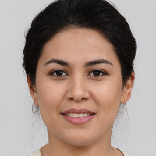 Joyful asian young-adult female with medium  brown hair and brown eyes