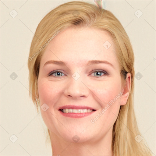 Joyful white young-adult female with long  brown hair and blue eyes