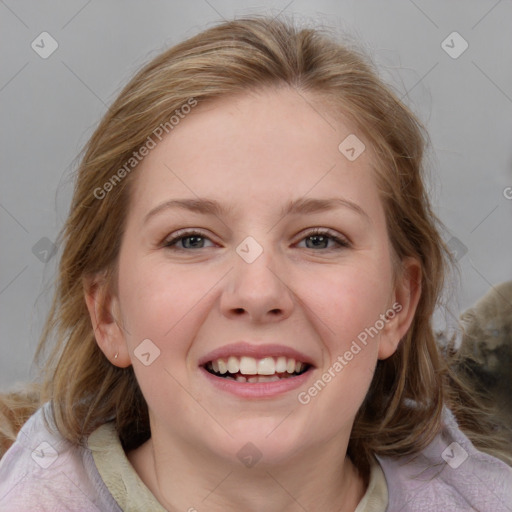 Joyful white young-adult female with medium  brown hair and blue eyes