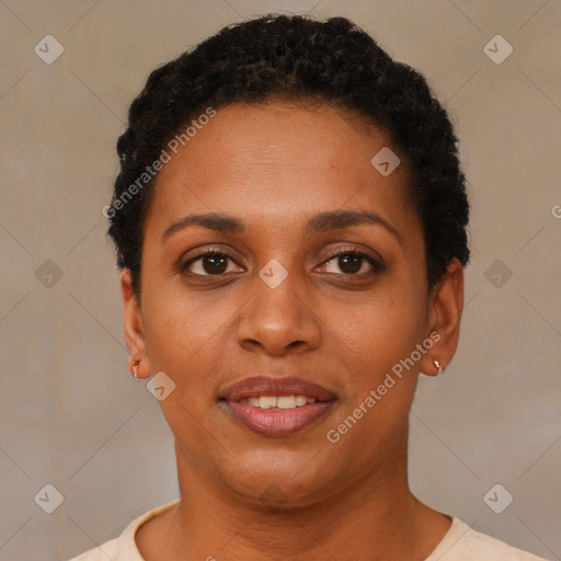 Joyful black young-adult female with short  black hair and brown eyes