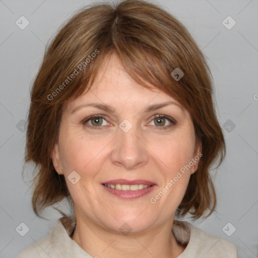 Joyful white adult female with medium  brown hair and blue eyes