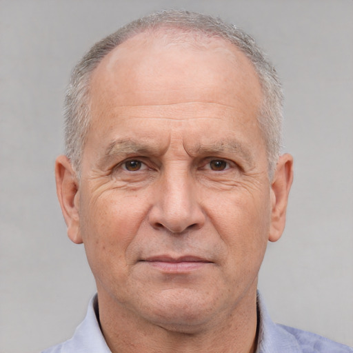 Neutral white middle-aged male with short  gray hair and brown eyes