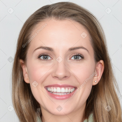 Joyful white young-adult female with long  brown hair and grey eyes