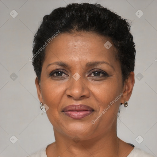 Joyful black adult female with short  brown hair and brown eyes