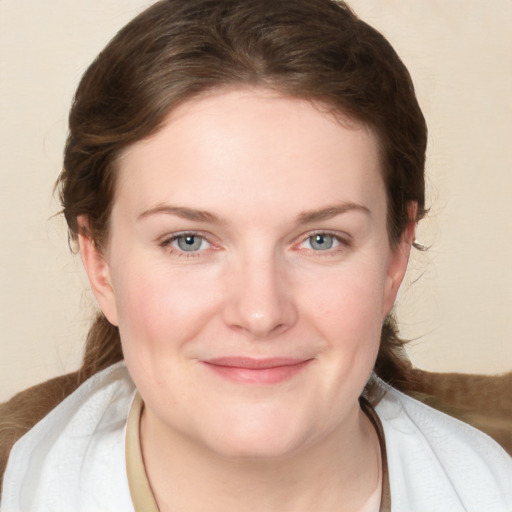 Joyful white young-adult female with medium  brown hair and blue eyes