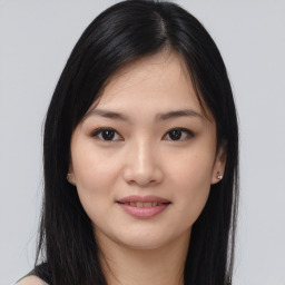 Joyful asian young-adult female with medium  black hair and brown eyes