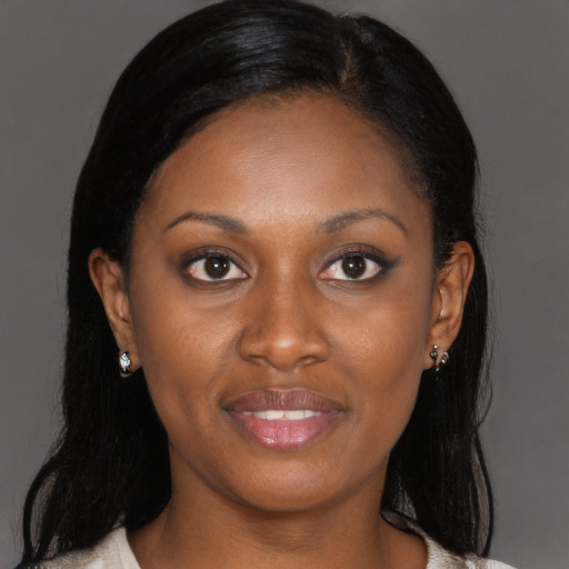 Joyful black young-adult female with medium  brown hair and brown eyes