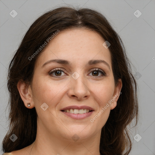 Joyful white adult female with medium  brown hair and grey eyes