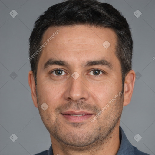 Joyful white adult male with short  brown hair and brown eyes