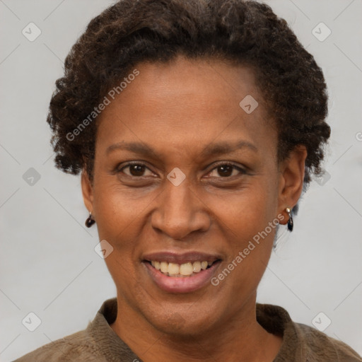 Joyful black adult female with short  brown hair and brown eyes