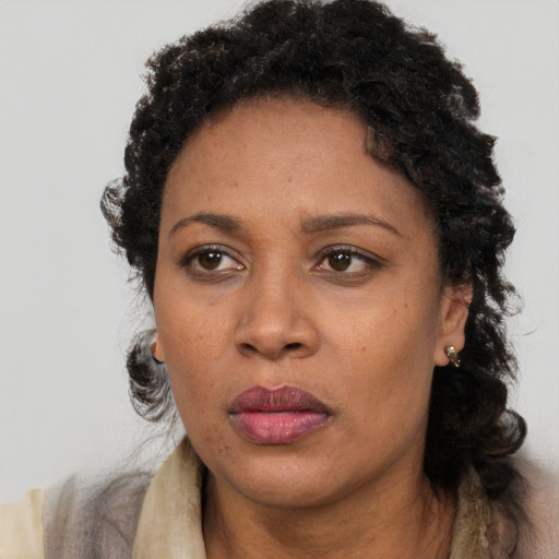 Neutral black adult female with short  brown hair and brown eyes