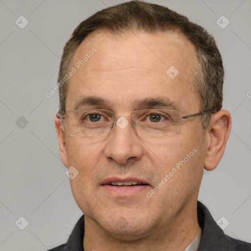 Joyful white adult male with short  brown hair and brown eyes