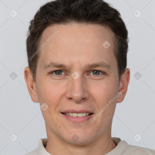 Joyful white adult male with short  brown hair and brown eyes