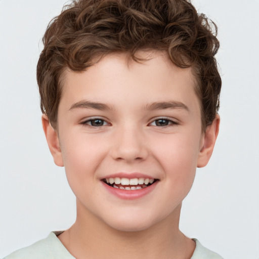 Joyful white child male with short  brown hair and brown eyes