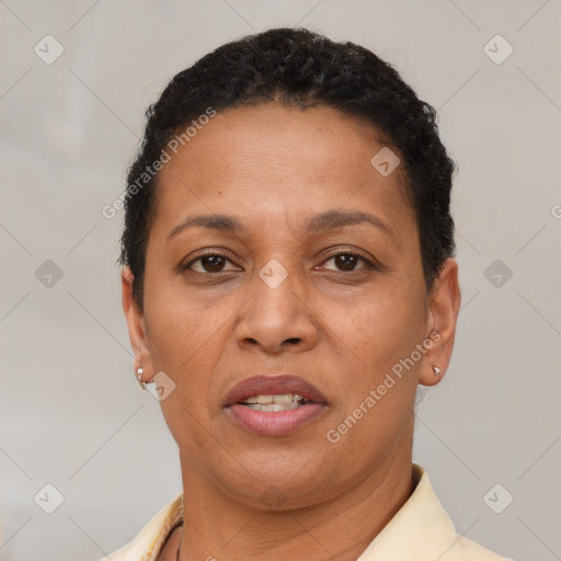 Joyful latino adult female with short  brown hair and brown eyes