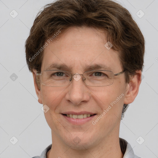 Joyful white adult male with short  brown hair and grey eyes