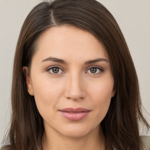 Neutral white young-adult female with long  brown hair and brown eyes